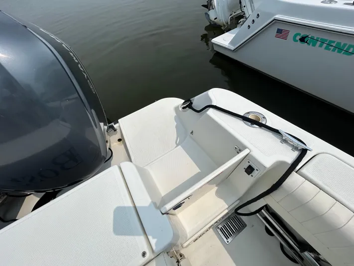 Good Sport Yacht Photos Pics 2011 Hydra-Sports 3000 VX boat stern with motor and docked alongside another vessel.