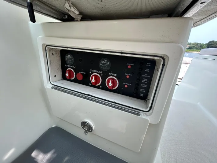 Good Sport Yacht Photos Pics Control panel of a 2011 Hydra-Sports 3000 VX boat with red switches.