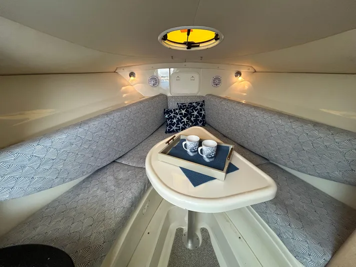 Good Sport Yacht Photos Pics 2011 Hydra-Sports 3000 VX cabin interior with cozy seating and a small table.