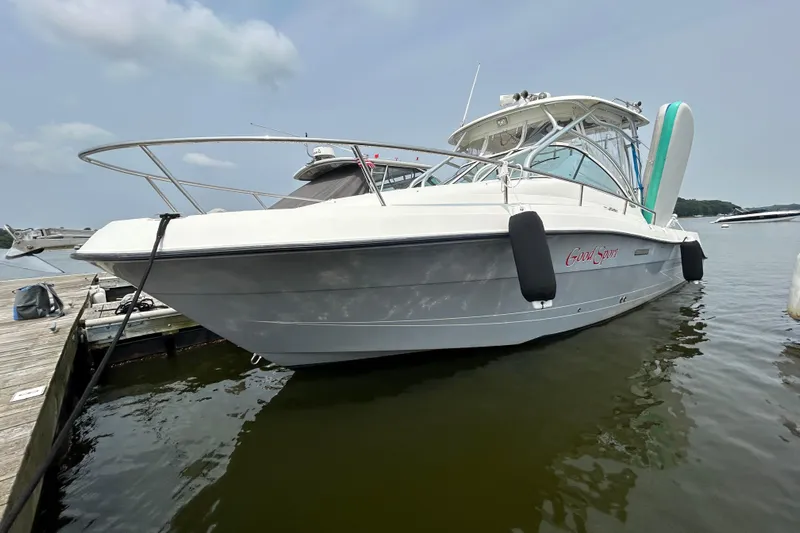Good Sport Yacht Photos Pics 2011 Hydra-Sports 3000 VX boat docked on calm water, side view.