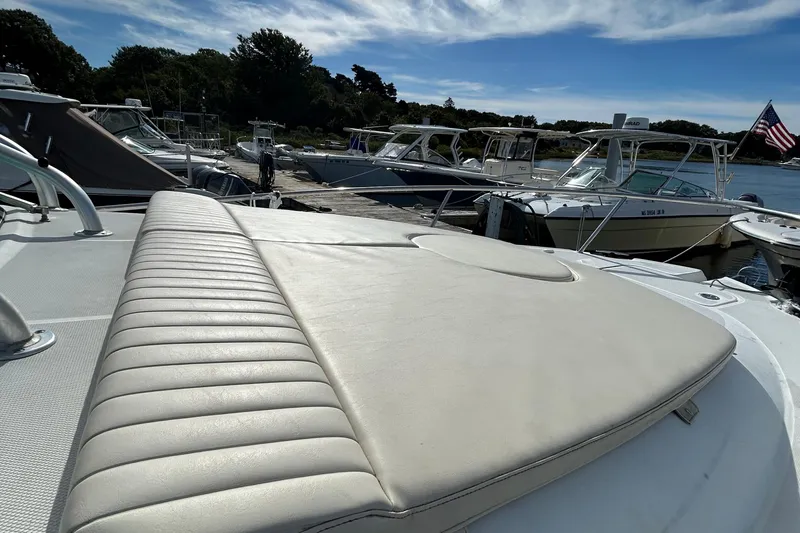 Good Sport Yacht Photos Pics 2011 Hydra-Sports 3000 VX boat docked, featuring a cushioned sunbathing area.