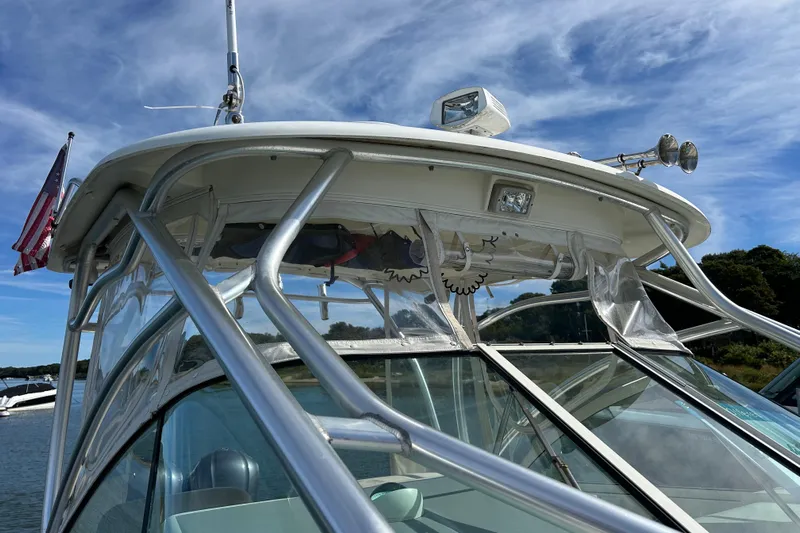 Good Sport Yacht Photos Pics 2011 Hydra-Sports 3000 VX boat with American flag, clear skies, and sleek design.