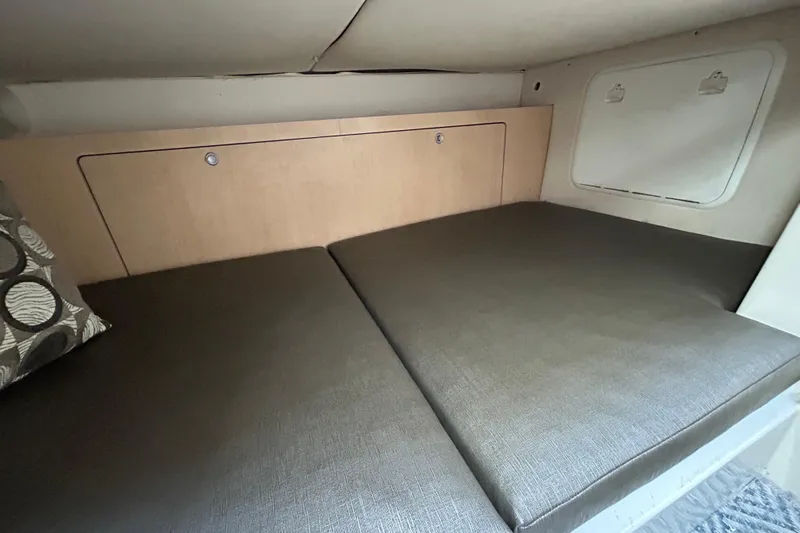 Good Sport Yacht Photos Pics 2011 Hydra-Sports 3000 VX cabin interior with cushioned seating and storage compartments.