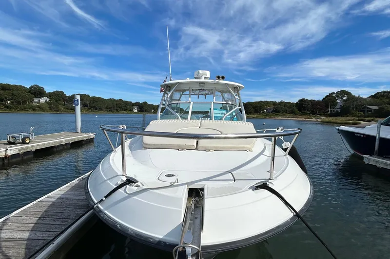 Good Sport Yacht Photos Pics 2011 Hydra-Sports 3000 VX boat docked on a sunny day, surrounded by calm water.