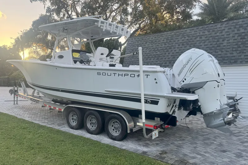  Yacht Photos Pics 2023 Southport 30 FE boat on trailer with dual Mercury engines, parked outdoors.