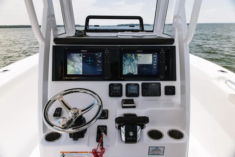  Yacht Photos Pics Manufacturer Provided Image: 2026 Sea Pro 265FLX Sandbar boat dashboard with navigation screens and steering wheel.