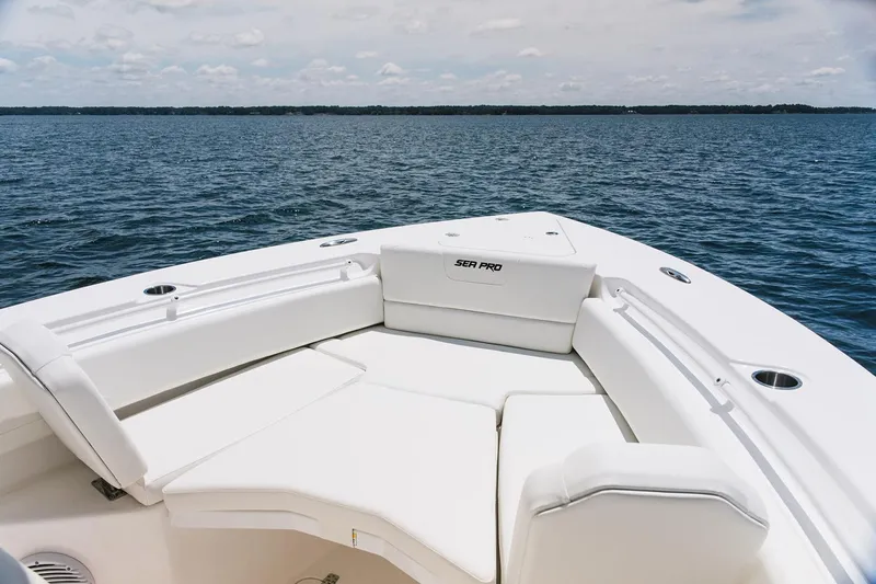  Yacht Photos Pics Manufacturer Provided Image: 2026 Sea Pro 265FLX Sandbar boat with white seating, on calm water.