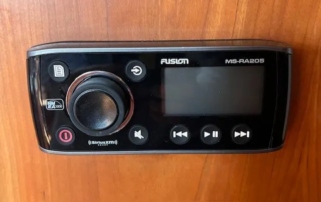 Force 10 Yacht Photos Pics Fusion MS-RA205 marine stereo on Tartan 3400, 2008 model, mounted on wooden panel.