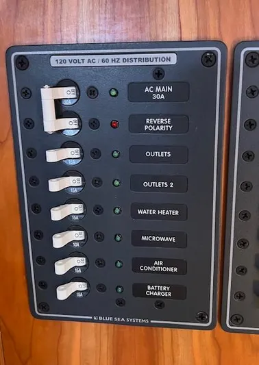 Force 10 Yacht Photos Pics Electrical panel with switches for AC main, outlets, water heater, microwave, and more. Tartan 3400, 2008.