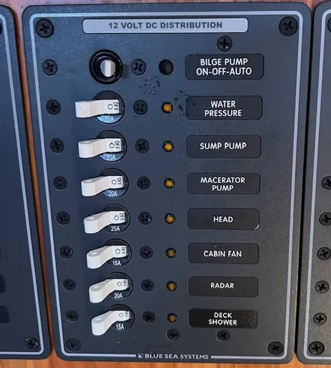 Force 10 Yacht Photos Pics 12V DC distribution panel with labeled switches for various boat systems, Tartan 3400, 2008.
