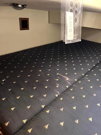 Force 10 Yacht Photos Pics Cushioned interior of 2008 Tartan 3400 yacht with patterned upholstery.