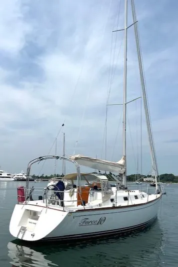 Force 10 Yacht Photos Pics 2008 Tartan 3400 sailboat on calm water, featuring a sleek white hull and tall mast.