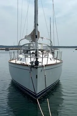 Force 10 Yacht Photos Pics 2008 Tartan 3400 sailboat docked in calm waters, front view.