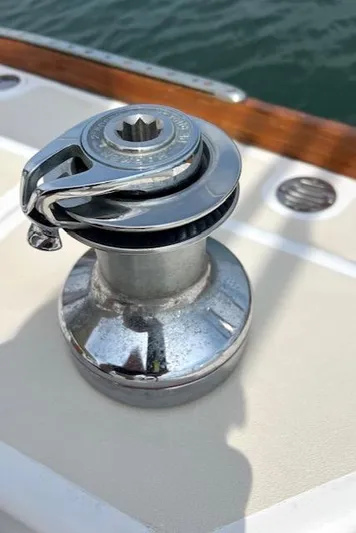 Force 10 Yacht Photos Pics Chrome winch on 2008 Tartan 3400 sailboat deck, near water.