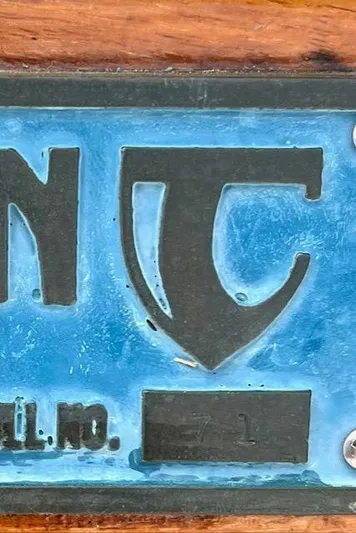 Force 10 Yacht Photos Pics Close-up of a Tartan 3400 emblem, model year 2008, with blue background.