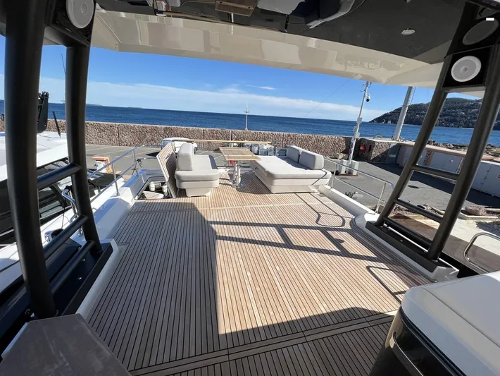  Yacht Photos Pics Luxurious 2023 Prestige X60 yacht deck with elegant seating and ocean view.