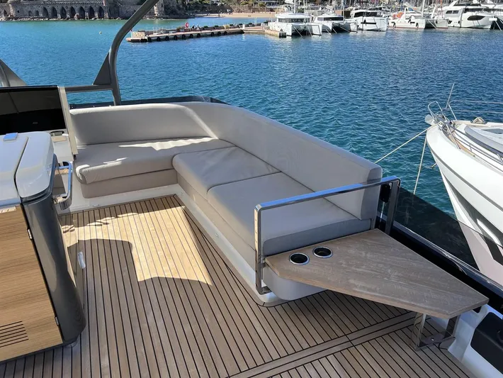  Yacht Photos Pics Luxurious 2023 Prestige X60 yacht deck with elegant seating and ocean view.
