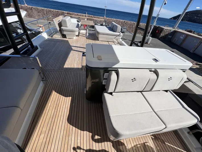  Yacht Photos Pics Luxurious 2023 Prestige X60 yacht deck with modern seating and ocean view.