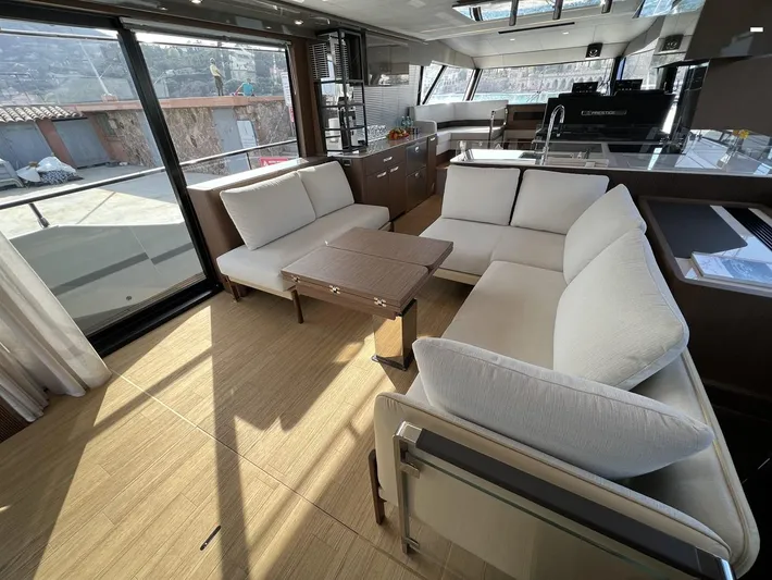  Yacht Photos Pics Luxurious interior of 2023 Prestige X60 yacht with modern seating and panoramic windows.