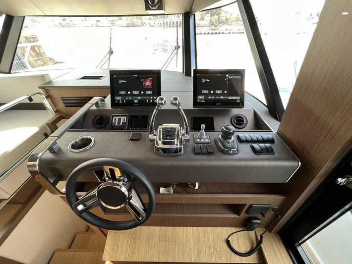  Yacht Photos Pics Helm of 2023 Prestige X60 yacht with dual screens and modern controls.