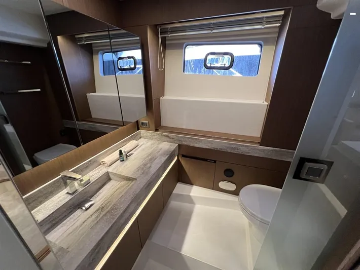  Yacht Photos Pics Luxurious bathroom in 2023 Prestige X60 yacht with modern fixtures and elegant design.