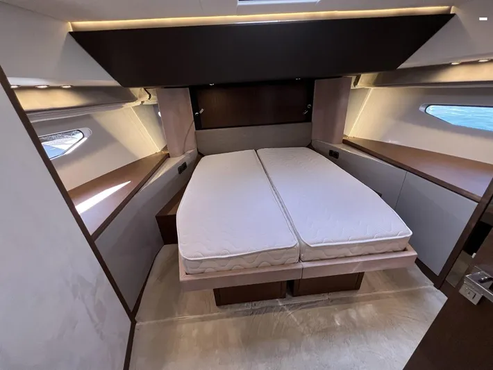  Yacht Photos Pics Luxurious bedroom interior of 2023 Prestige X60 yacht with modern design and twin beds.