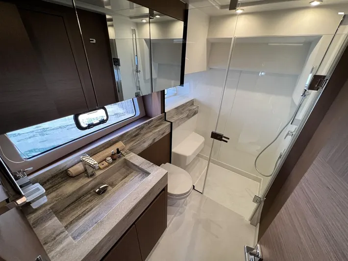  Yacht Photos Pics Luxurious bathroom in 2023 Prestige X60 yacht with modern fixtures and elegant design.