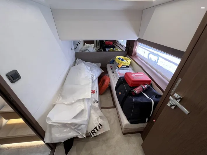  Yacht Photos Pics Interior cabin of 2023 Prestige X60 yacht with storage items and equipment.