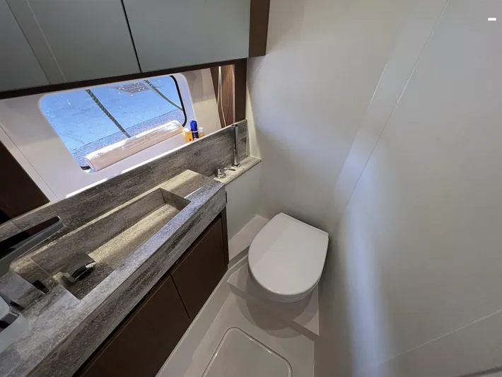  Yacht Photos Pics Modern bathroom in 2023 Prestige X60 yacht with sleek sink and toilet.