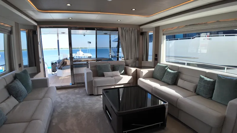  Yacht Photos Pics Luxurious interior of 2024 Gulf Craft Nomad 65 yacht with elegant seating and ocean view.