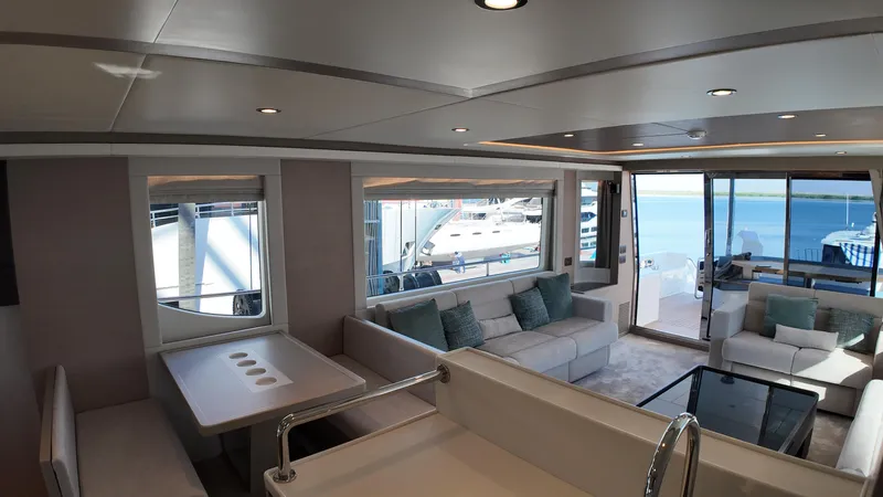  Yacht Photos Pics Luxurious interior of 2024 Gulf Craft Nomad 65 yacht with modern seating and ocean view.