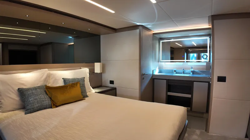  Yacht Photos Pics Luxurious bedroom interior of 2024 Gulf Craft Nomad 65 yacht with modern design.