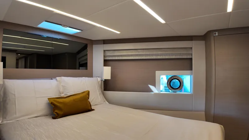  Yacht Photos Pics Luxurious bedroom interior of 2024 Gulf Craft Nomad 65 yacht with modern design.