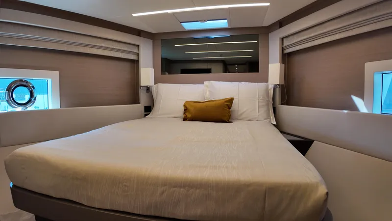  Yacht Photos Pics Luxurious bedroom interior of 2024 Gulf Craft Nomad 65 yacht with modern design.