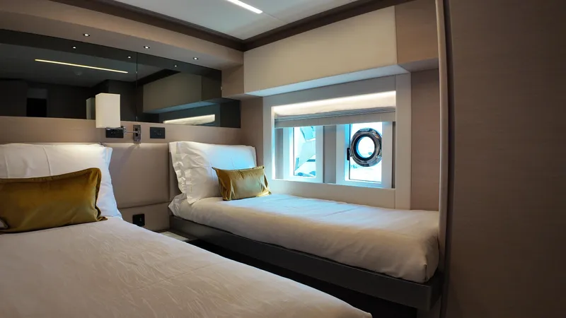  Yacht Photos Pics Luxurious twin cabin interior of 2024 Gulf Craft Nomad 65 yacht with modern design.