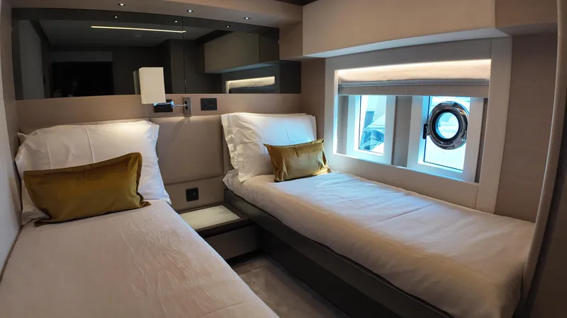  Yacht Photos Pics Luxurious twin cabin interior of 2024 Gulf Craft Nomad 65 yacht with modern design.