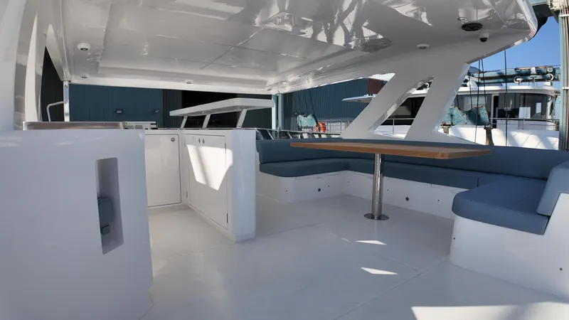  Yacht Photos Pics 2024 Gulf Craft Nomad 65 yacht interior with modern seating and sleek design.