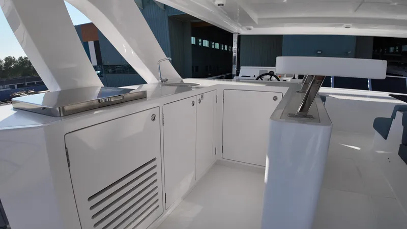  Yacht Photos Pics 2024 Gulf Craft Nomad 65 yacht interior with sleek white cabinetry and modern design.