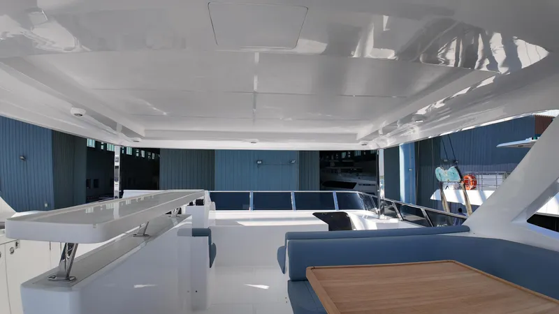  Yacht Photos Pics Luxurious 2024 Gulf Craft Nomad 65 yacht interior with sleek design and spacious seating area.