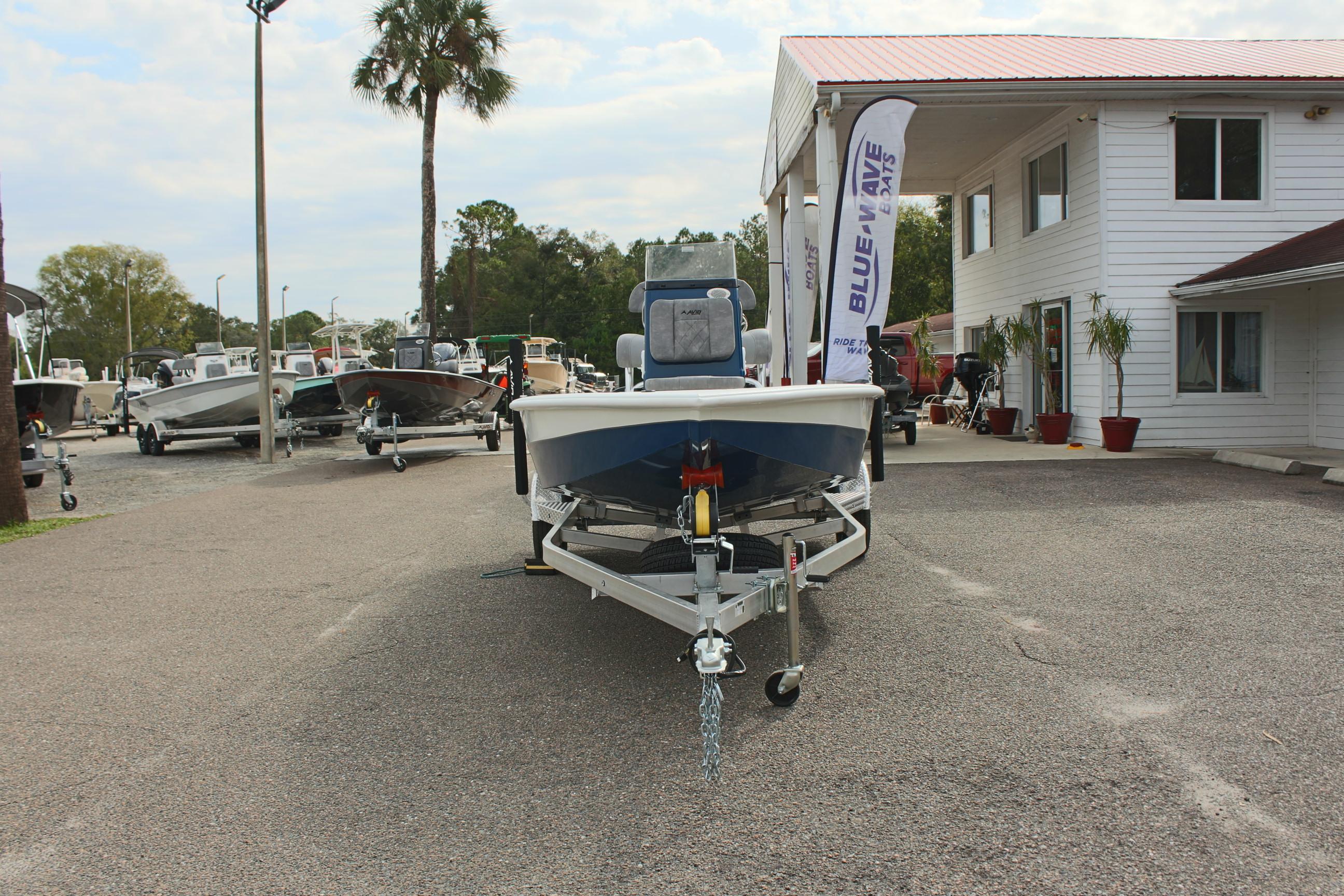 2025 Avid 19 FSX boat on trailer at dealership lot.