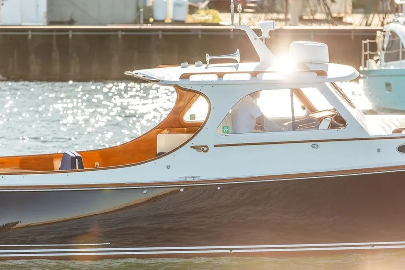 Hobnob Yacht Photos Pics 2001 Hinckley Yachts Picnic Boat Classic 36 on sunlit water, showcasing elegant design.
