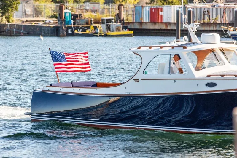Hobnob Yacht Photos Pics 2001 Hinckley Yachts Picnic Boat Classic 36 cruising with American flag on water.