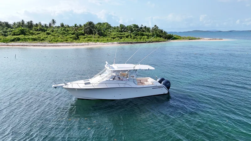  Yacht Photos Pics 2006 Grady-White Express 330 boat near tropical island shoreline.