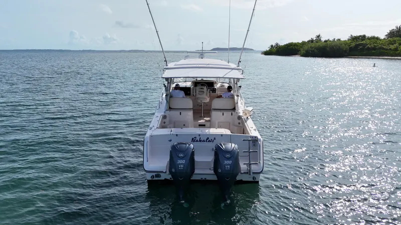  Yacht Photos Pics 2006 Grady-White Express 330 boat with dual engines on calm water.