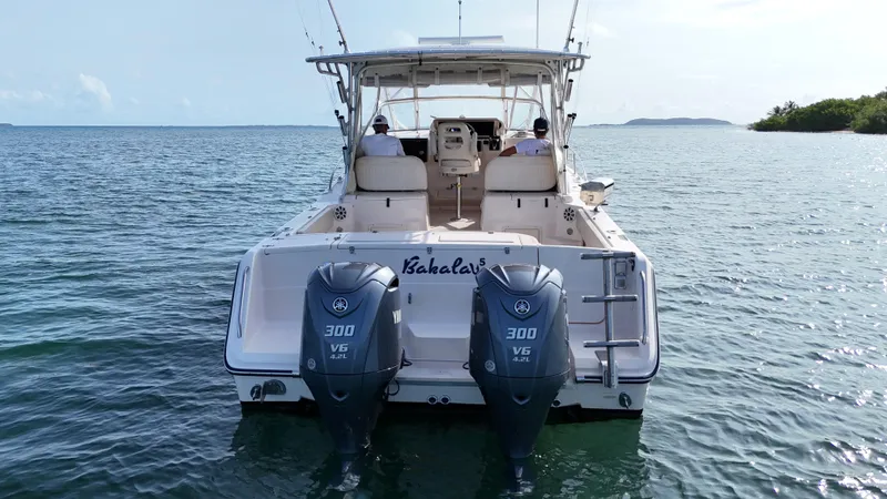  Yacht Photos Pics 2006 Grady-White Express 330 boat with twin 300 HP engines on open water.