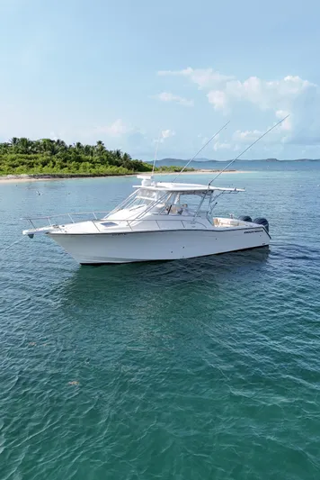  Yacht Photos Pics 2006 Grady-White Express 330 boat on calm sea near tropical island.