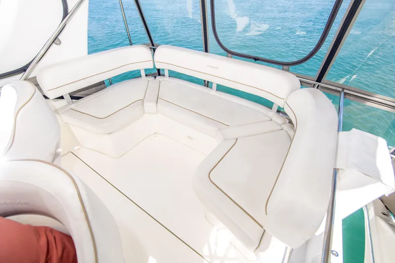 Journeys Edge Yacht Photos Pics 2007 Silverton 36 Convertible yacht with white cushioned seating and ocean view.