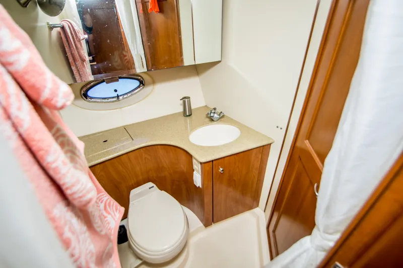 Journeys Edge Yacht Photos Pics 2007 Silverton 36 Convertible yacht bathroom with sink, toilet, and mirror.