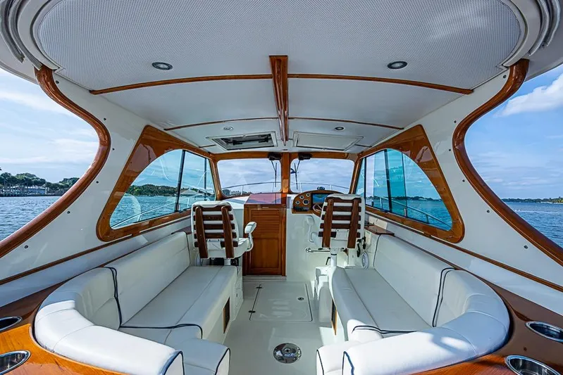 Comin' In Hot Yacht Photos Pics Interior of 2016 Hinckley Talaria 34 yacht with elegant seating and wooden accents.