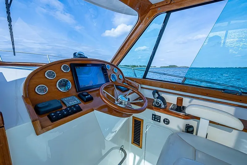 Comin' In Hot Yacht Photos Pics Helm of 2016 Hinckley Talaria 34 yacht with ocean view and navigation instruments.